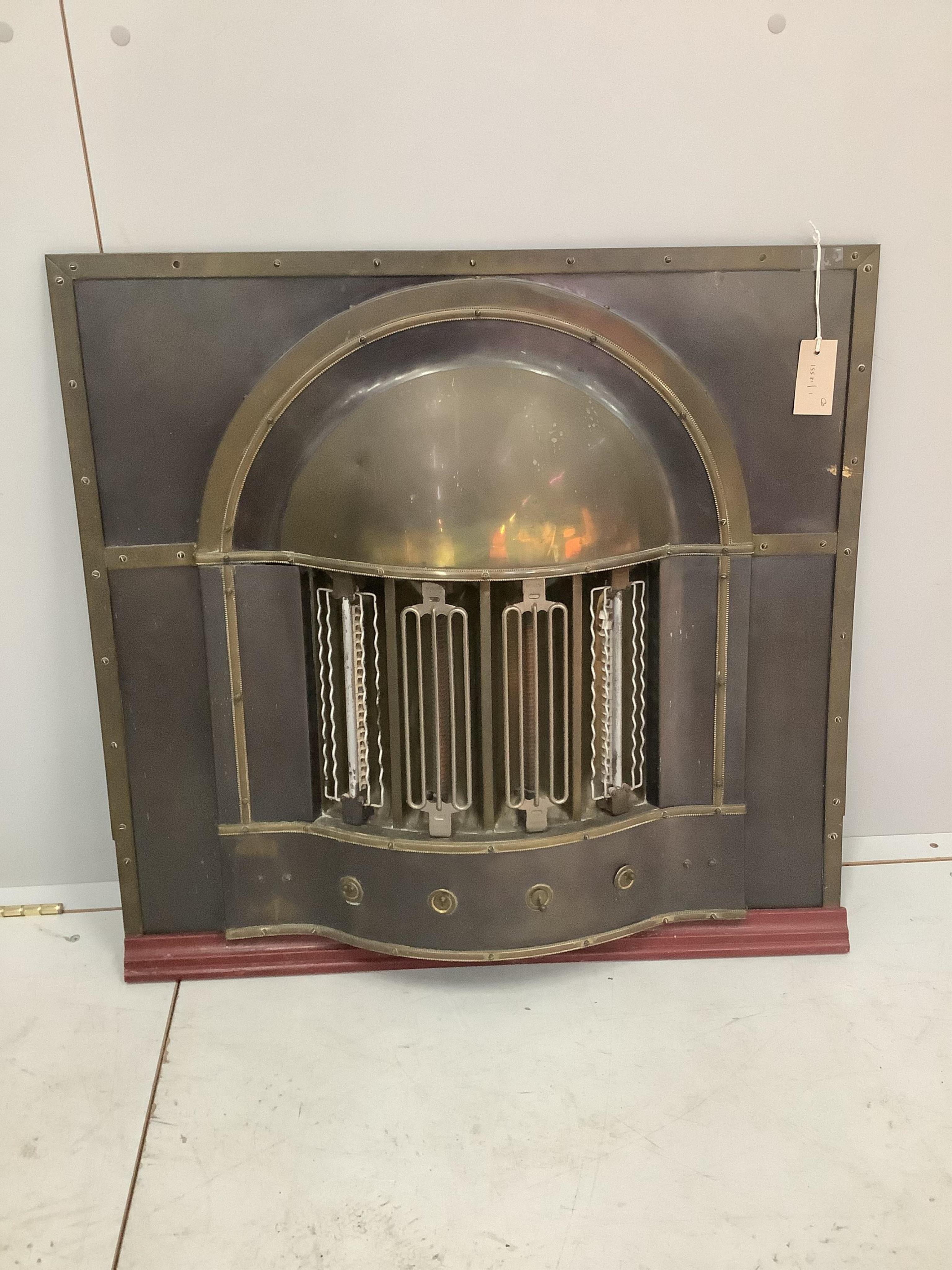 Three early 20th century French brass and copper mounted electric fires, largest width 77cm, height 73cm. Condition - fair